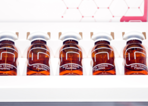Peptide nootropics UK 2026 laboratory image showing multiple amber glass peptide vials stored in a refrigerated laboratory rack. The photograph represents peptide manufacturing, research peptides, quality control, laboratory storage conditions, pharmaceutical production standards, and scientific research into cognitive peptides and peptide nootropics.