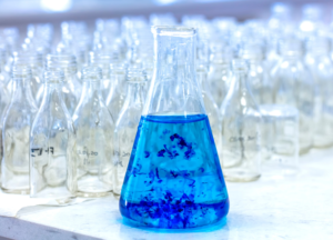 Methylene Blue solution in a laboratory flask used to study mitochondrial respiration and ATP production